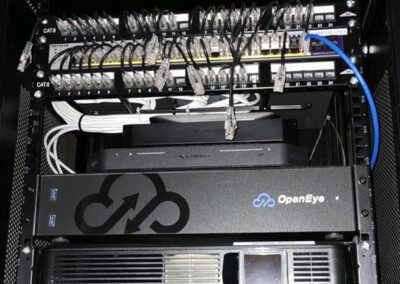 Network rack housing camera cabling and an Open Eye NVR.